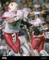 nebraska-quarterback-eric-crouch-7-has-his-head-turned-around-by-kansas-state-linebacker-travi...jpg