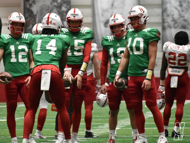 Jeff Sims (14) and the rest of the Nebraska quarterbacks at Thursday's spring practice.