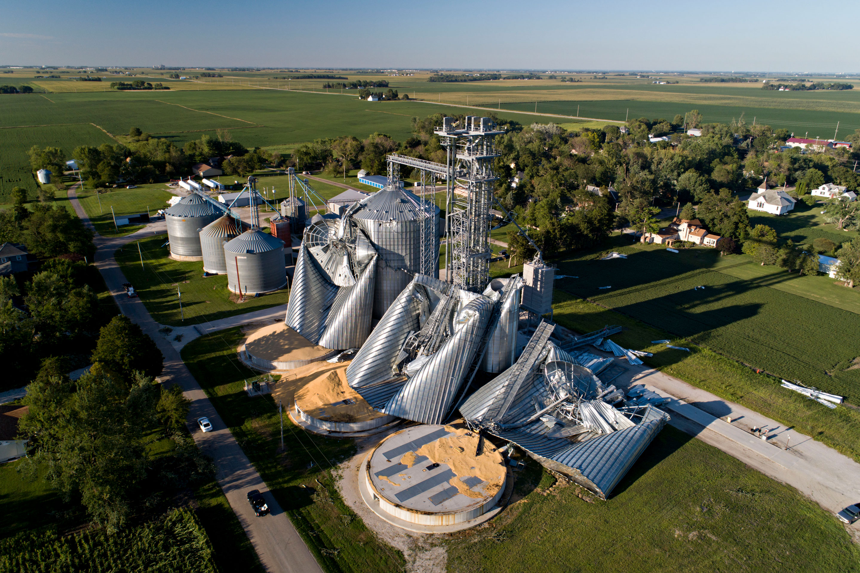 LUTHER, IA - AUGUST 11: In this aerial image from a drone, damaged grain bins are shown at the Heartland Co-Op grain elevator on August 11, 2020 in Luther, Iowa. Iowa Gov. Kim Reynolds said early estimates indicate 10 million acres, nearly a 1/3 of the states land used for crops, were damaged when a powerful storm battered the region a day earlier. (Photo by Daniel Acker/Getty Images)