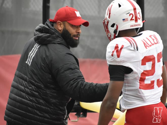 Nebraska RBs coach E.J. Barthel pulls Ajay Allen aside during a teachable moment.